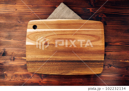 Wooden cutting board. Copy the space for the text. Food and menu background. Wooden cutting board. Copy the space for the text. Food and menu background. 102232134