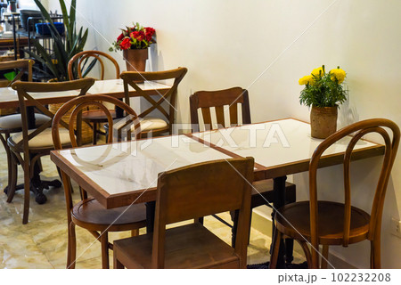 Loft style with wooden furniture in a Vietnamese coffee shop Loft style with wooden furniture in a Vietnamese coffee shop 102232208
