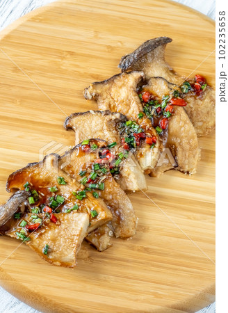 Battered eryngii mushrooms 102235658