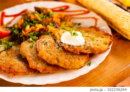 belarusian draniki with grilled beef dish in a restaurant belarusian draniki with grilled beef dish in a restaurant 102236264