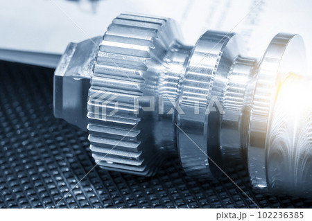 Close-up scene of transmission  gear spare parts in the light blue scene. 102236385