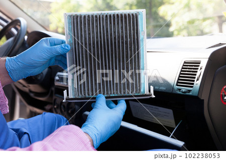 Replacing dirty cabin pollen air filter for a car 102238053