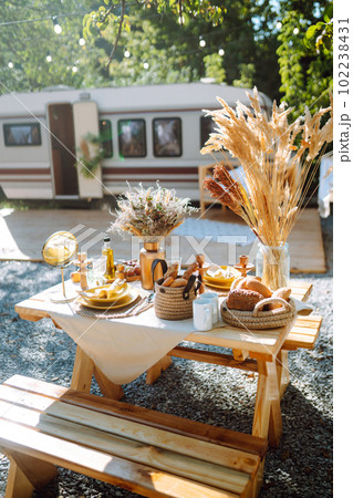 Floral decorations on the banquet table outdoor. The work of professional florists in emerald color. 102238431