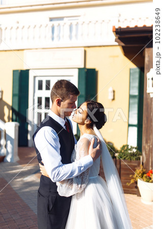 Newlyweds tenderly hug, kiss and enjoy each other. Walk of lovers. Amazing smiling wedding couple. Love. Newlyweds tenderly hug, kiss and enjoy each other. Walk of lovers. Amazing smiling wedding couple. Love. 102238649