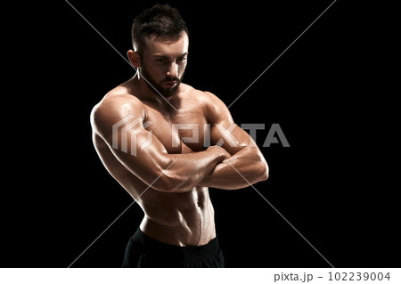 Muscular bodybuilder guy doing posing 102239004
