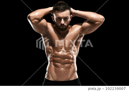 Muscular bodybuilder guy doing posing Muscular bodybuilder guy doing posing 102239007