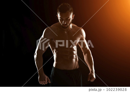 Muscular bodybuilder guy doing posing 102239028