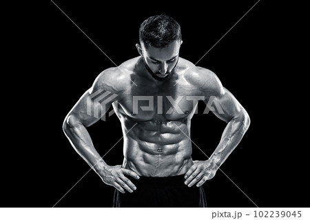 Muscular bodybuilder guy doing posing 102239045