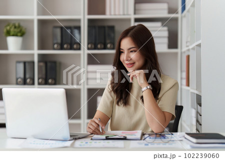 Accountant woman working on laptop and do document, tax, exchange, research, accounting and Financial advisor concept 102239060