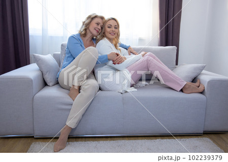 Family of two whiling away the time at home 102239379