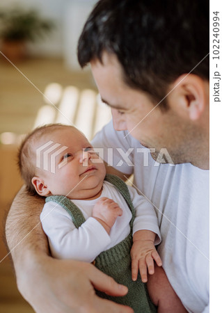 Close-up of father holding his little son. Close-up of father holding his little son. 102240994