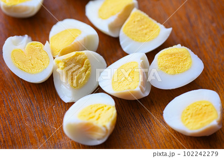 boiled eggs food, quail eggs on wooden, breakfast eggs with fresh quail eggs and vegetable lettuce on table background 102242279