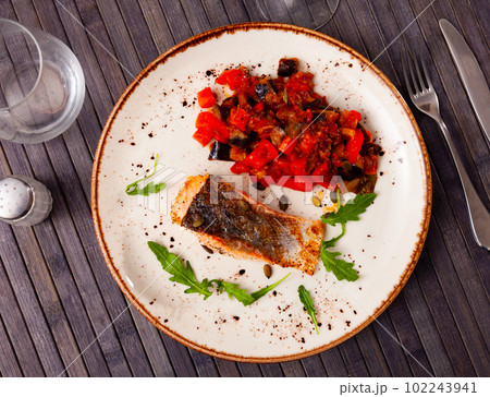 Appetizing salmon with stewed vegetables Appetizing salmon with stewed vegetables 102243941