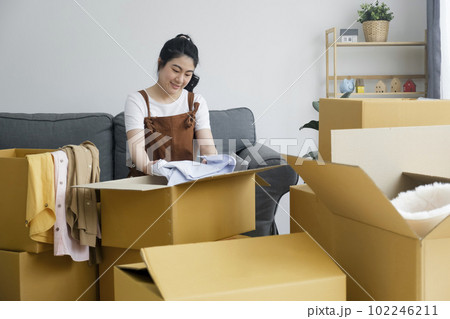 Modern female people in moving home apartment leisure indoor activity alone. Modern female people in moving home apartment leisure indoor activity alone. 102246211