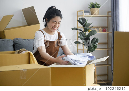 Modern female people in moving home apartment leisure indoor activity alone. 102246212