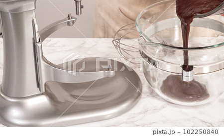 Step by step. Whipping chocolate ganache with an electric kitchen mixer. Step by step. Whipping chocolate ganache with an electric kitchen mixer. 102250840