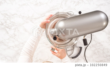 Flat lay. Step by step. Whipping chocolate ganache with an electric kitchen mixer. Flat lay. Step by step. Whipping chocolate ganache with an electric kitchen mixer. 102250849