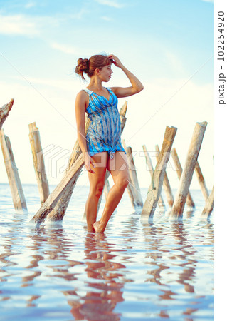 a girl in a swimsuit on a salt lake a girl in a swimsuit on a salt lake 102254920