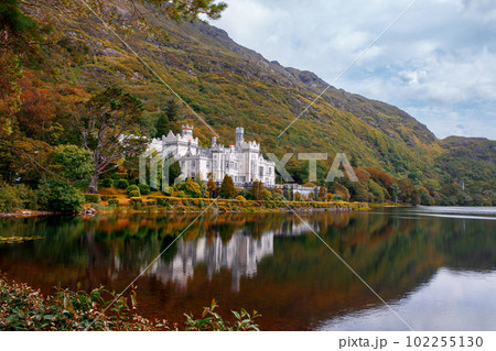 Kylemore Abbey with water reflections in Connemara, County Galway, Ireland, Europe. Benedictine monastery founded 1920 on the grounds of Kylemore Castle. Mainistir na Coille Moire 102255130