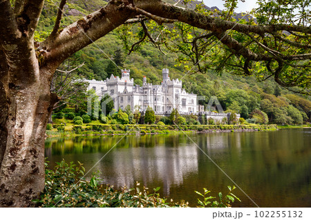 Kylemore Abbey with water reflections in Connemara, County Galway, Ireland, Europe. Benedictine monastery founded 1920 on the grounds of Kylemore Castle. Mainistir na Coille Moire Kylemore Abbey with water reflections in Connemara, County Galway, Ireland, Europe. Benedictine monastery founded 1920 on the grounds of Kylemore Castle. Mainistir na Coille Moire 102255132