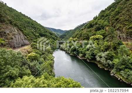 View of the village of Os Peares, Ourense, Galicia in Spain, where the Sil and Mino rivers converge. View of the village of Os Peares, Ourense, Galicia in Spain, where the Sil and Mino rivers converge. 102257094