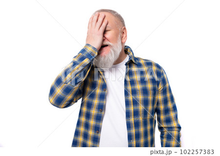 portrait of a handsome 60s middle-aged gray-haired man with a beard in a shirt covering his face portrait of a handsome 60s middle-aged gray-haired man with a beard in a shirt covering his face 102257383