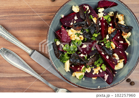 Beetroot salad with wallnuts and cheese. Beetroot salad with wallnuts and cheese. 102257960