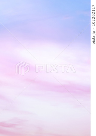Twilight sky with effect of light in pastel pink, coral, orange, blue tones. Colorful sunset of soft clouds. Background. Vertical Twilight sky with effect of light in pastel pink, coral, orange, blue tones. Colorful sunset of soft clouds. Background. Vertical 102262117