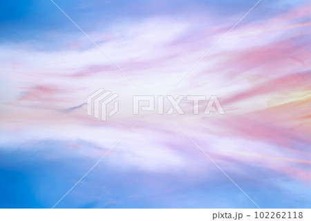 Twilight sky with effect of light in pastel pink, coral, orange, blue tones. Colorful sunset of soft clouds. Background Twilight sky with effect of light in pastel pink, coral, orange, blue tones. Colorful sunset of soft clouds. Background 102262118