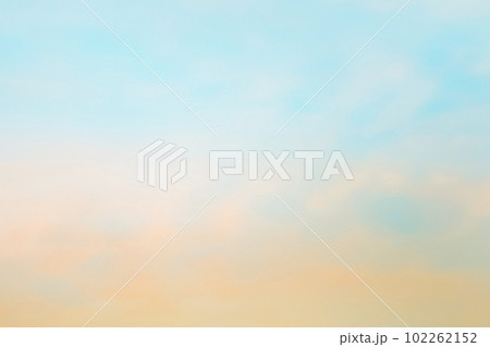 Twilight sky with effect of light in pastel pink, coral, orange, blue tones. Colorful sunset of soft clouds. Background Twilight sky with effect of light in pastel pink, coral, orange, blue tones. Colorful sunset of soft clouds. Background 102262152