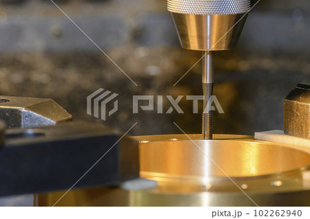 The tapping process on NC milling machine at the brass material parts. The tapping process on NC milling machine at the brass material parts. 102262940