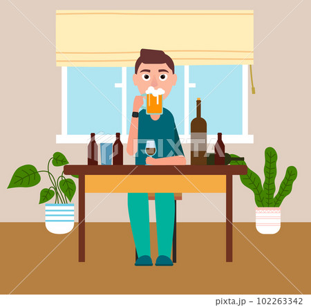 I stay at home. Man at the table is drinking beer. Guy is drinking alcohol. Self isolation mode 102263342