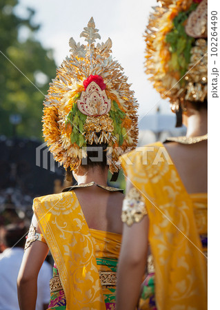 Procession of beautiful Balinese women in traditional costumes Procession of beautiful Balinese women in traditional costumes 102264490