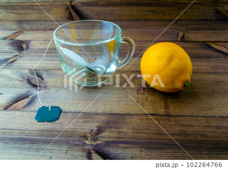 Tea mug with tea bag and lemon. 102264766