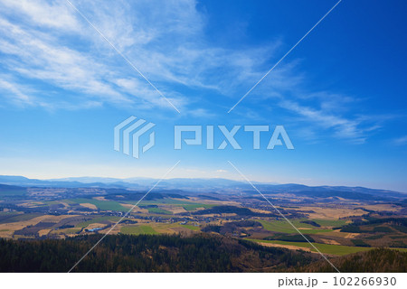 Beautiful mountains covered with evergreen forest on sunny day. Natural landscape with mountain ranges and valleys 102266930