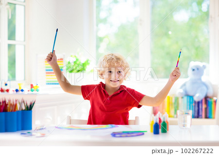 Kids paint. Child painting. Little boy drawing. 102267222