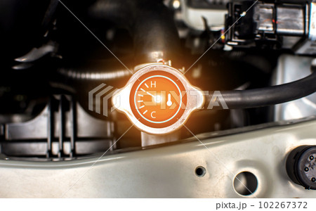 Car radiator cap with water temp gauge and shows the overheating of radiator in engine compartment Car radiator cap with water temp gauge and shows the overheating of radiator in engine compartment 102267372