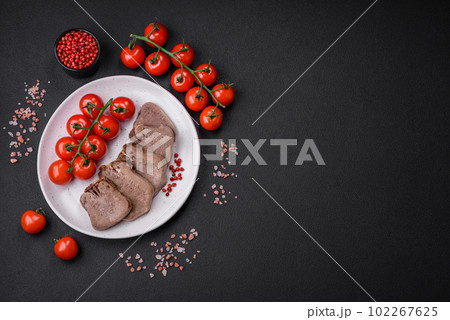 Delicious boiled beef tongue sliced with vegetables and spices 102267625