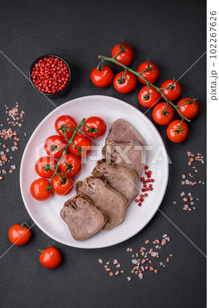Delicious boiled beef tongue sliced with vegetables and spices 102267626