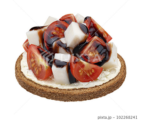 Cheese and tomato sandwich with balsamic sauce isolated on white background Cheese and tomato sandwich with balsamic sauce isolated on white background 102268241