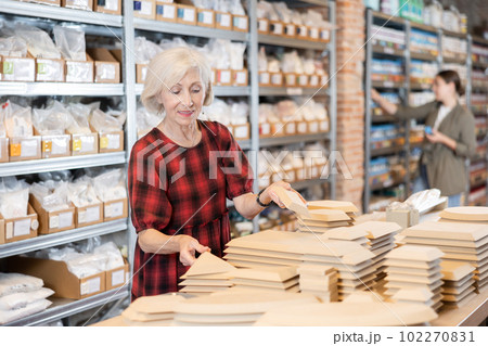 Elderly woman chooses blanks for making pottery Elderly woman chooses blanks for making pottery 102270831