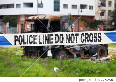 British police tape barricading a burnt truck British police tape barricading a burnt truck 102275250