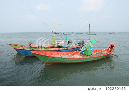 Colorful fishing boat floating on the sea. 102280146