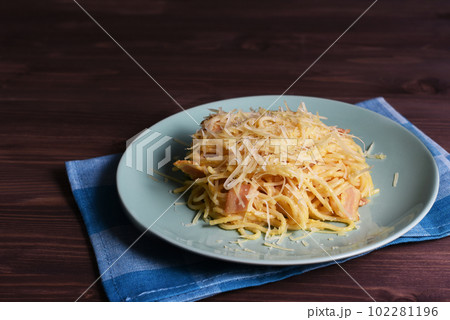 Carbonara pasta on wooden background with copy space. Spaghetti with parmesan cheese, eggs and pancetta. Pasta alla carbonara. Carbonara pasta on wooden background with copy space. Spaghetti with parmesan cheese, eggs and pancetta. Pasta alla carbonara. 102281196