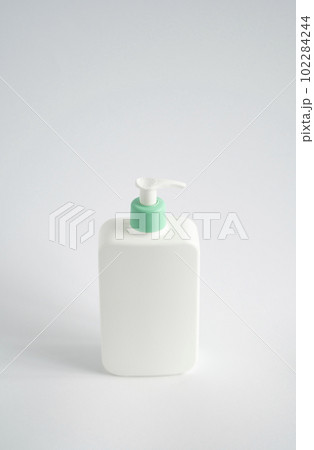 White unbranded dispenser shampoo, gel, soap bottle isolated on white background. Cosmetic packaging mockup with copy space. 102284244