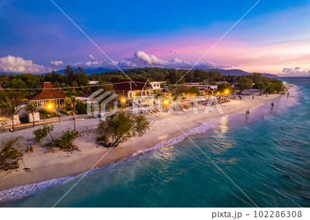Aerial view of Gili Trawangan beach during sunset in Lombok, Indonesia Aerial view of Gili Trawangan beach during sunset in Lombok, Indonesia 102286308