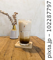 Iced coffee with milk in coffee shop 102287797