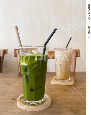 Green tea with coconut juice in coffee shop cafe Green tea with coconut juice in coffee shop cafe 102287800