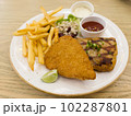 Fish and chips with grilled chicken spicy steak 102287801