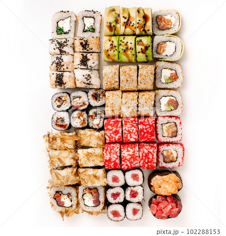Big colorful sushi set on a white background. Top view. 102288153